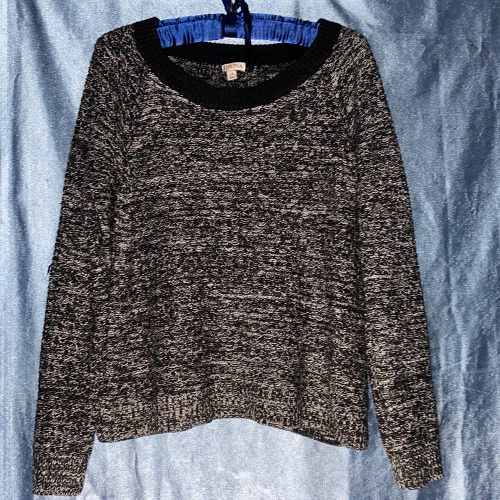 Black/white Full Sweater with small slits on both sides of the long sleeves.